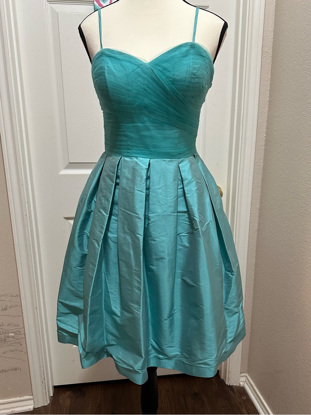 Light green strapless party dress with pleated skirt